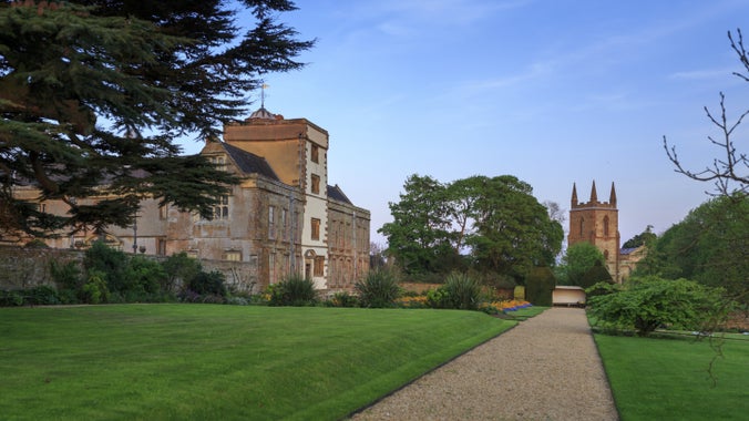 Exterior view of Canons Ashby House and Church in spring